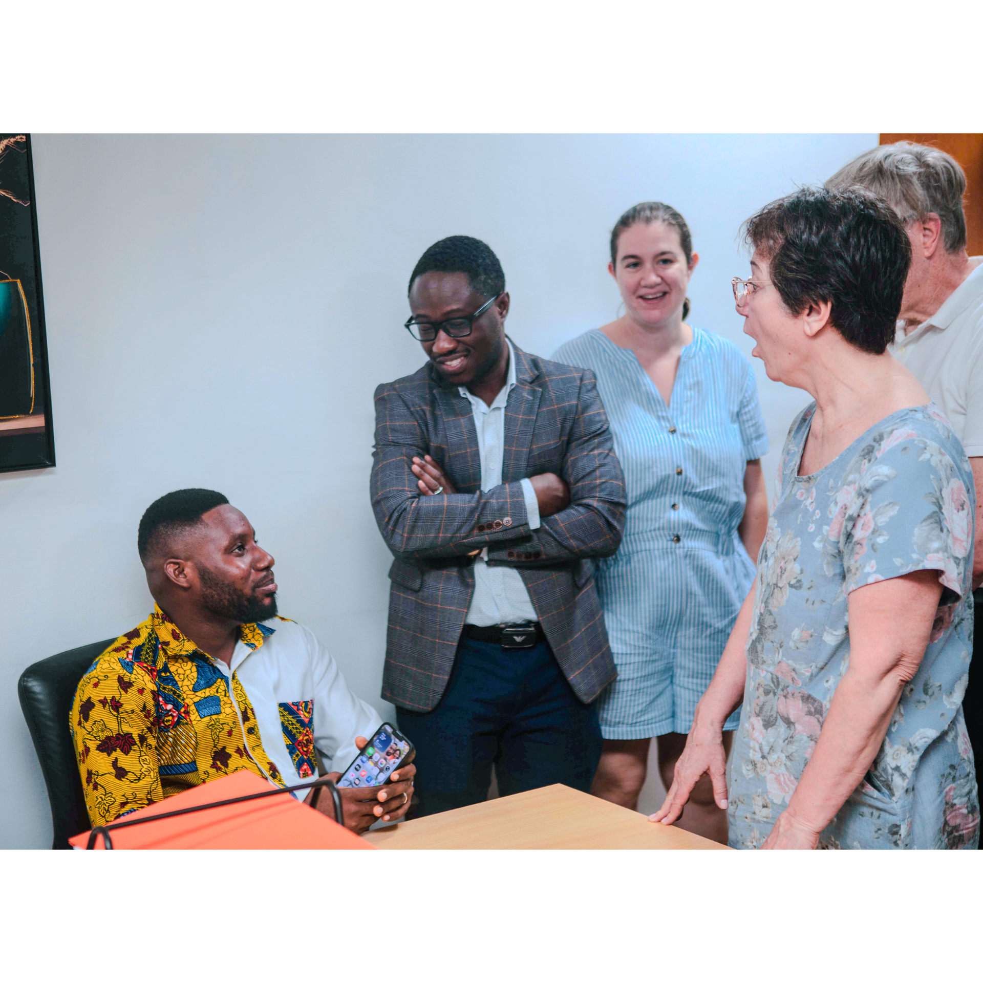 Stephen Oppong with international research partners discussing the study findings